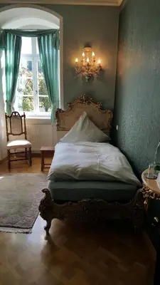 Ein Bett oder Betten in einem Zimmer der Unterkunft Schloss Sennfeld - Hotel & Restaurant & Veranstaltungsort