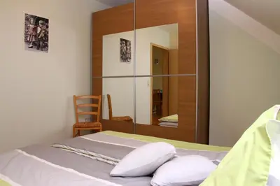 Ein Bett oder Betten in einem Zimmer der Unterkunft Ferienwohnungen Haus Albert