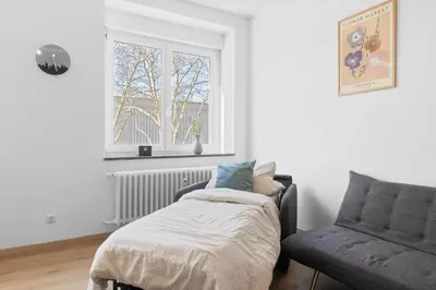 Ein Bett oder Betten in einem Zimmer der Unterkunft - NEU - Große & gemütliche 3 Zimmer Wohnung