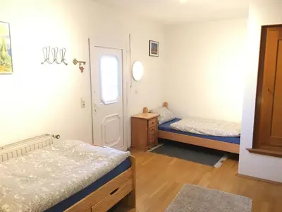 Ein Bett oder Betten in einem Zimmer der Unterkunft Ferienwohnung Südpfalzblick