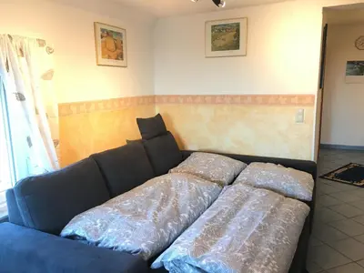 Ein Bett oder Betten in einem Zimmer der Unterkunft Ferienwohnung Südpfalzblick
