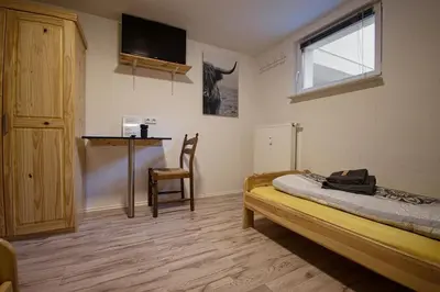 Ein Bett oder Betten in einem Zimmer der Unterkunft Haus Rheinsheimer Scheuer