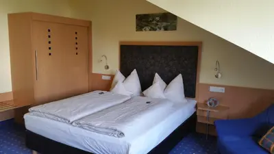 Ein Bett oder Betten in einem Zimmer der Unterkunft Hotel Ifen