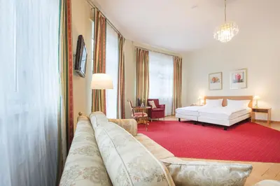 Ein Bett oder Betten in einem Zimmer der Unterkunft Hotel Markgräfler Hof
