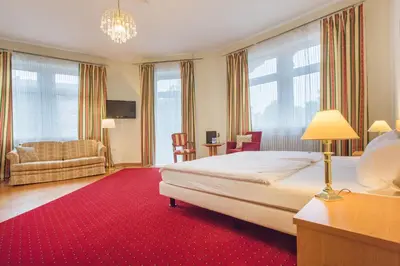 Ein Bett oder Betten in einem Zimmer der Unterkunft Hotel Markgräfler Hof