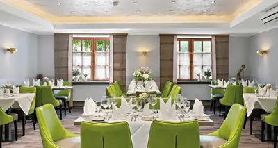 Ein Restaurant oder anderes Speiselokal in der Unterkunft Pfalzhotel Asselheim
