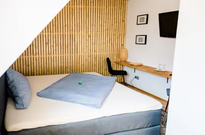 Ein Bett oder Betten in einem Zimmer der Unterkunft Gasthaus & Hotel Bischoff