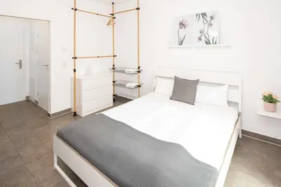 Ein Bett oder Betten in einem Zimmer der Unterkunft Nibelungen Apartments