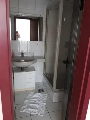 Ein Badezimmer in der Unterkunft Adler Gaststube Hotel Biergarten