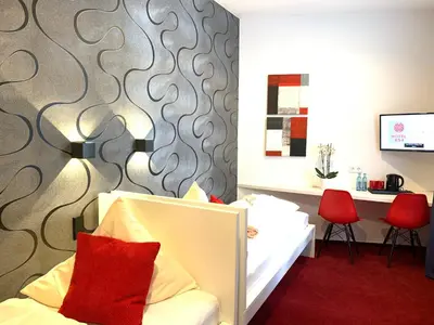 Ein Bett oder Betten in einem Zimmer der Unterkunft Hotel B54 Heidelberg City