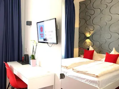 Ein Bett oder Betten in einem Zimmer der Unterkunft Hotel B54 Heidelberg City