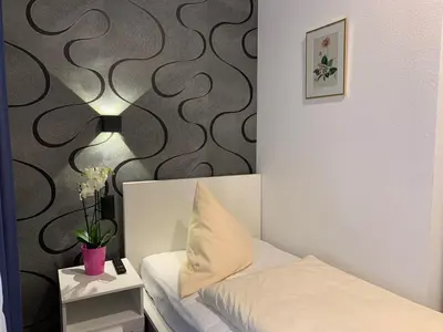 Ein Bett oder Betten in einem Zimmer der Unterkunft Hotel B54 Heidelberg City