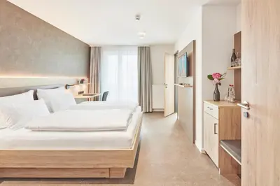 Ein Bett oder Betten in einem Zimmer der Unterkunft Gästehaus Bauer - Schlafen auf dem Weingut