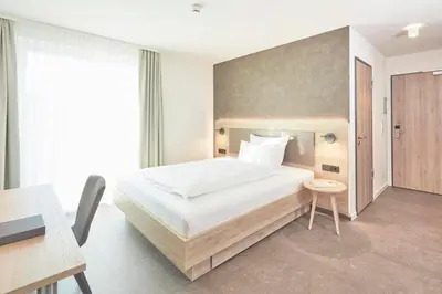 Ein Bett oder Betten in einem Zimmer der Unterkunft Gästehaus Bauer - Schlafen auf dem Weingut