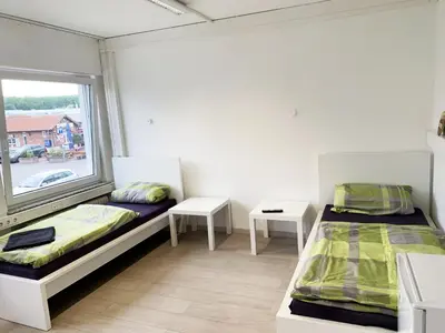 Ein Bett oder Betten in einem Zimmer der Unterkunft My-Skypalace Bad-Friedrichshall