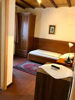 Ein Bett oder Betten in einem Zimmer der Unterkunft Hotel Restaurant Da Franco