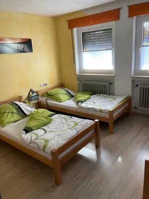 Ein Bett oder Betten in einem Zimmer der Unterkunft Ferienwohnung Schwarz