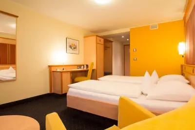 Ein Bett oder Betten in einem Zimmer der Unterkunft Hotel Rio Karlsruhe