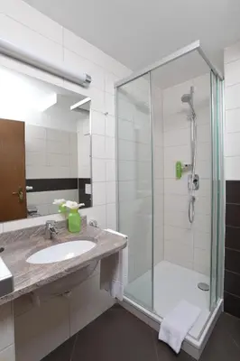 Ein Badezimmer in der Unterkunft Hotel Krone