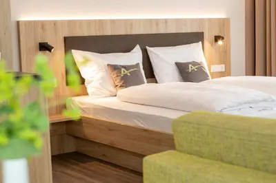Ein Bett oder Betten in einem Zimmer der Unterkunft Aparthotel Am Pfaffenstein
