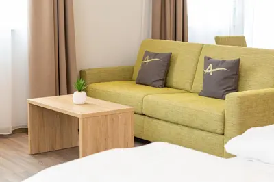 Ein Sitzbereich in der Unterkunft Aparthotel Am Pfaffenstein