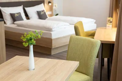 Ein Bett oder Betten in einem Zimmer der Unterkunft Aparthotel Am Pfaffenstein