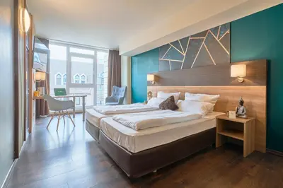 Ein Bett oder Betten in einem Zimmer der Unterkunft eXo Boutique Hotel Mannheim - by SuperFly Hotels