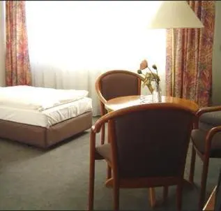 Ein Bett oder Betten in einem Zimmer der Unterkunft Hotel Stiftswingert