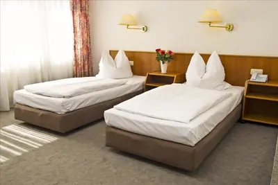 Ein Bett oder Betten in einem Zimmer der Unterkunft Hotel Stiftswingert