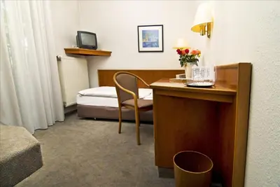 Ein Bett oder Betten in einem Zimmer der Unterkunft Hotel Stiftswingert