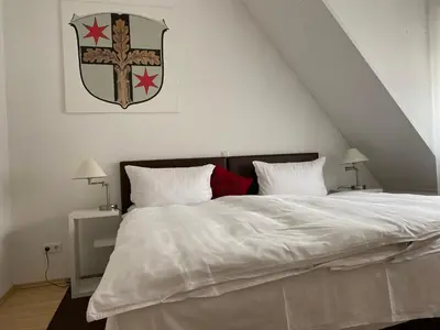 Ein Bett oder Betten in einem Zimmer der Unterkunft Ferienwohnung Wappenstube