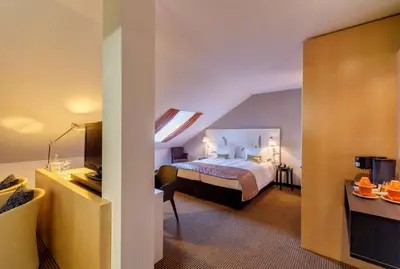 Ein Bett oder Betten in einem Zimmer der Unterkunft nestor Hotel Stuttgart-Ludwigsburg