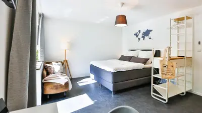 Ein Bett oder Betten in einem Zimmer der Unterkunft Studio HIRSCH56 - Zentral-Ruhig-Terrasse-Netflix