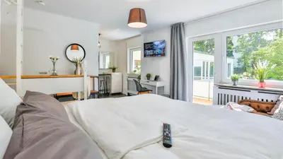 Ein Bett oder Betten in einem Zimmer der Unterkunft Studio HIRSCH56 - Zentral-Ruhig-Terrasse-Netflix