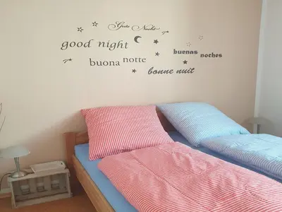 Ein Bett oder Betten in einem Zimmer der Unterkunft Fewo Pfalzwohnung Ellerstadt