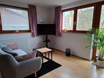 Ein Sitzbereich in der Unterkunft Ferienwohnung Am Wald