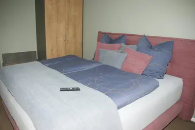 Ein Bett oder Betten in einem Zimmer der Unterkunft Ferienwohnung 'Burgblick'