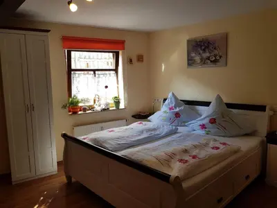 Ein Bett oder Betten in einem Zimmer der Unterkunft Zum Burgtörle