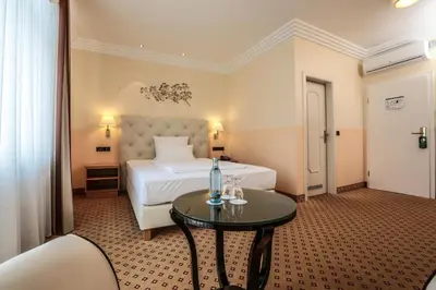 Ein Bett oder Betten in einem Zimmer der Unterkunft Hotel Mack Private Inn