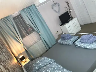 Ein Bett oder Betten in einem Zimmer der Unterkunft Ferienwohnung Natali