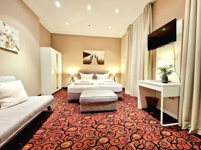 Ein Bett oder Betten in einem Zimmer der Unterkunft Hofgarten Apartments