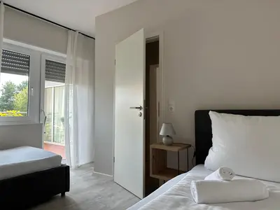 Ein Bett oder Betten in einem Zimmer der Unterkunft HGH - Hotel Garni Helbig