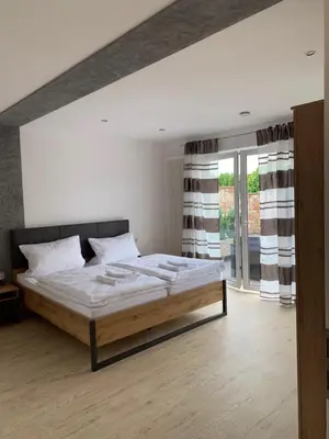Ein Bett oder Betten in einem Zimmer der Unterkunft HGH - Hotel Garni Helbig