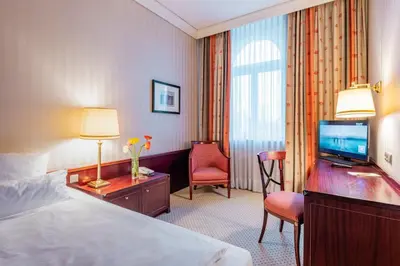 Ein Bett oder Betten in einem Zimmer der Unterkunft Parkhotel 1901 Mannheim