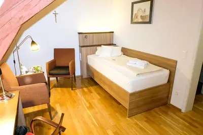 Ein Bett oder Betten in einem Zimmer der Unterkunft Kloster Schöntal