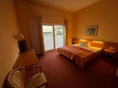 Ein Bett oder Betten in einem Zimmer der Unterkunft Landhotel Ritter-Post