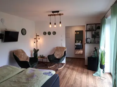 Ein Sitzbereich in der Unterkunft Weinlodge am Geissberg