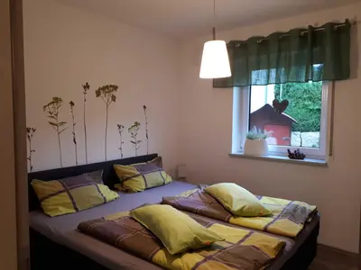 Ein Bett oder Betten in einem Zimmer der Unterkunft Weinlodge am Geissberg
