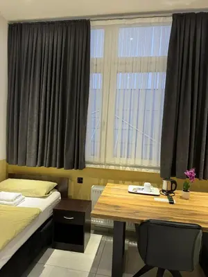 Ein Bett oder Betten in einem Zimmer der Unterkunft Stadtpension Heilbronn