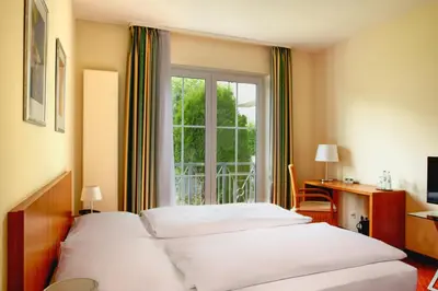 Ein Bett oder Betten in einem Zimmer der Unterkunft Hotel Zielonka